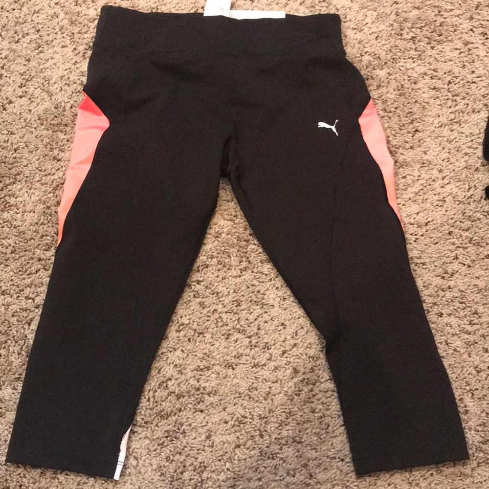 Black and salmon colored workout pants